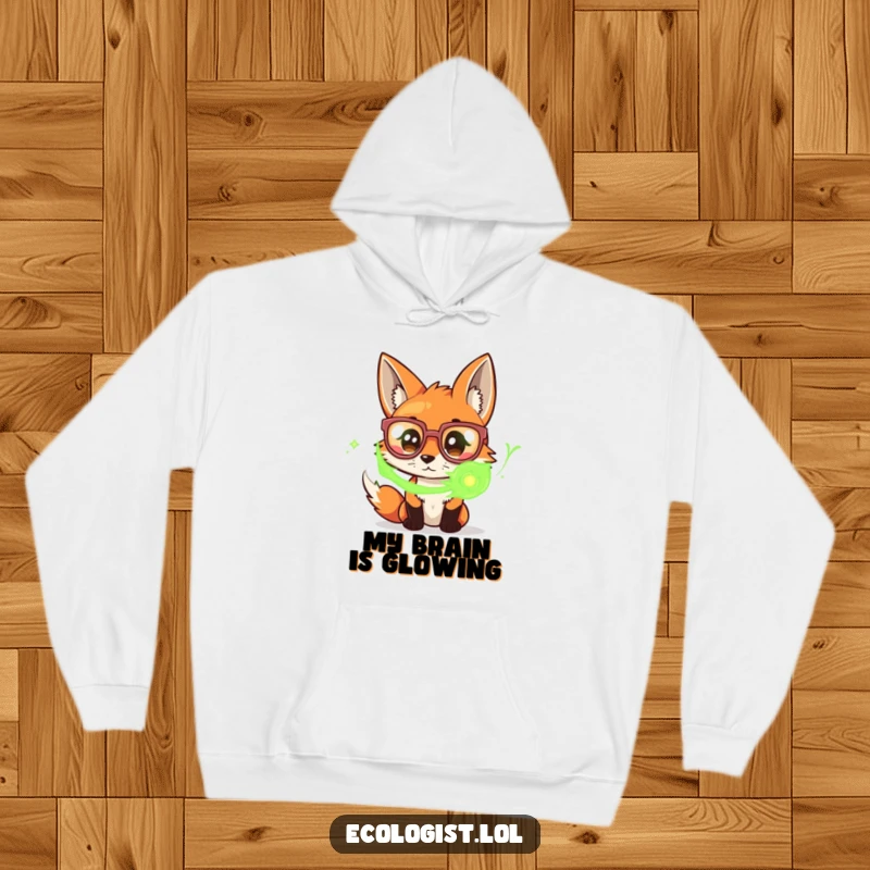 Funny hoodie with a curious fox wearing huge spectacles, intently focusing on a swirling mass of vibrant green energy, embodying deep thought.