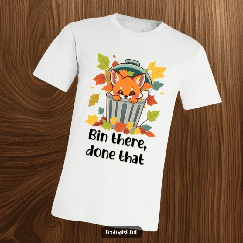 Funny fox cub peeking out from a recycling bin full of colorful leaves, a humorous t-shirt for animal lovers.